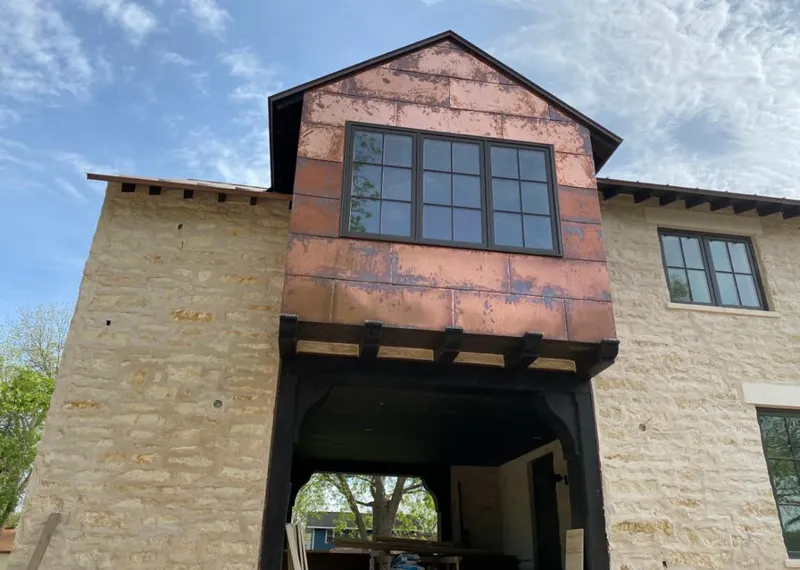 Copper metal panel facade on a stone building for Skylight Installation in West Cocalico